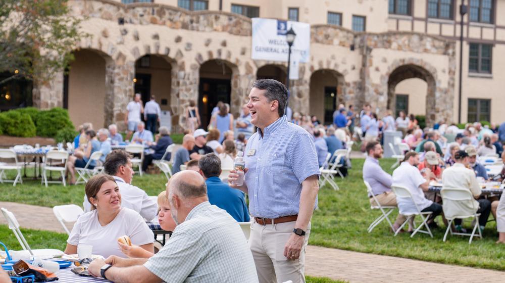 Brad Voyles talking to a family during the PCA General Assembly Picnic