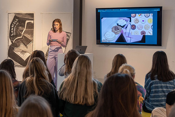 female student making presentation