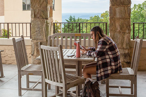 student studying outdoors