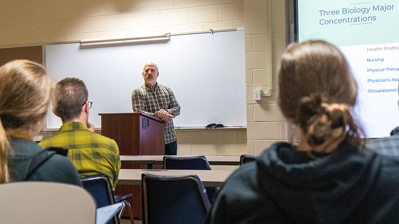 professor teaching class of students
