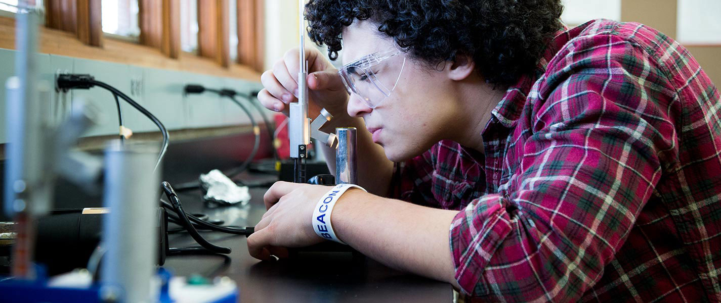 male student in science lab