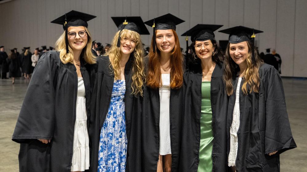 group of 5 female gradutates