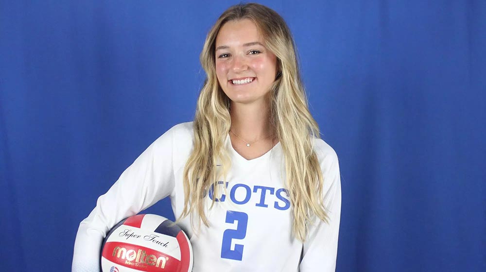 kyla bailey holding volleyball