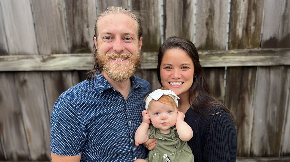jarrod with his wife and daughter