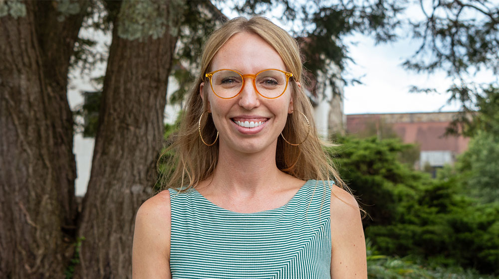 heather hess standing under a tree