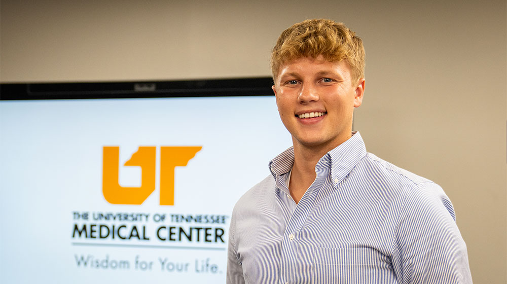 male student standing at his internship