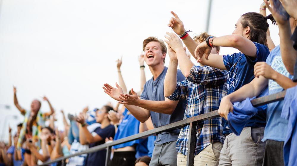 crowd cheering at a soccer game