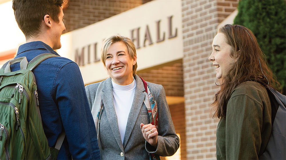 dr martinez talking to two students