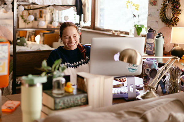 female student in dorm room