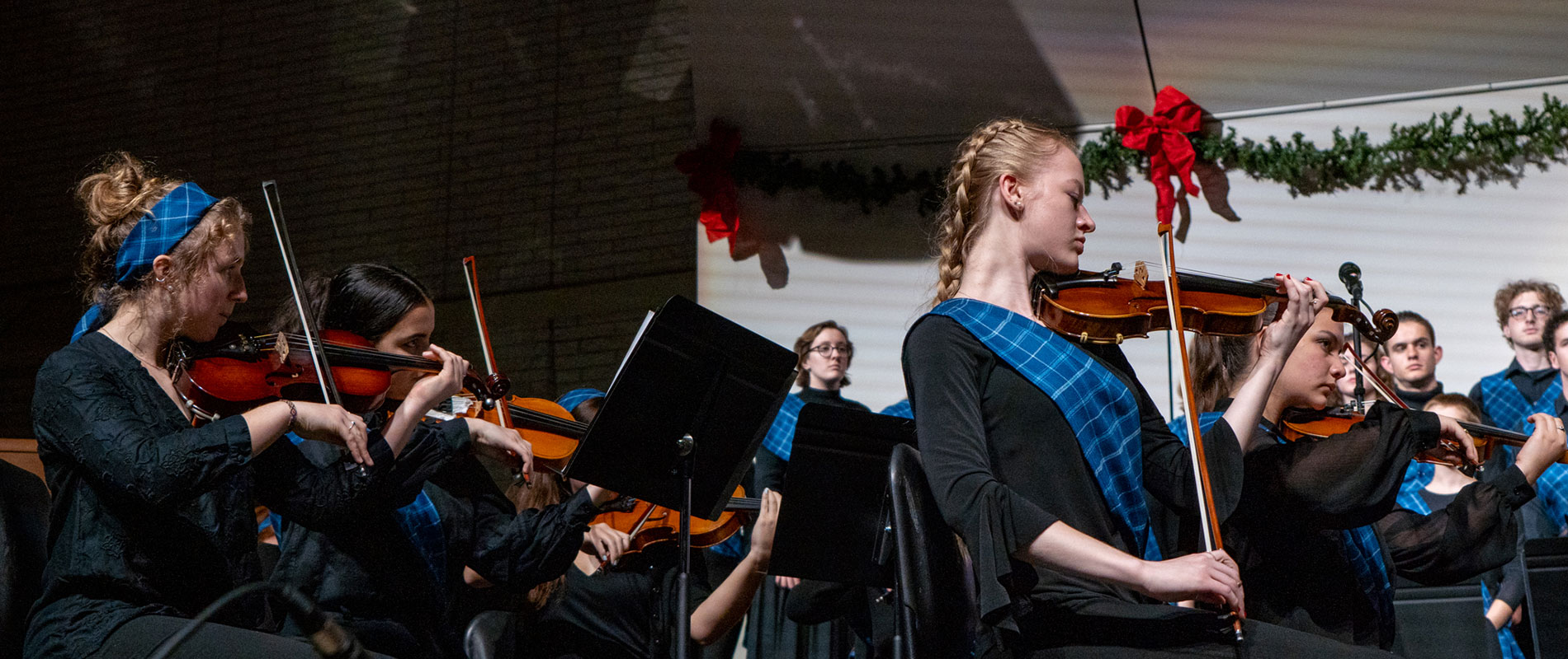 students playing instruments on stage