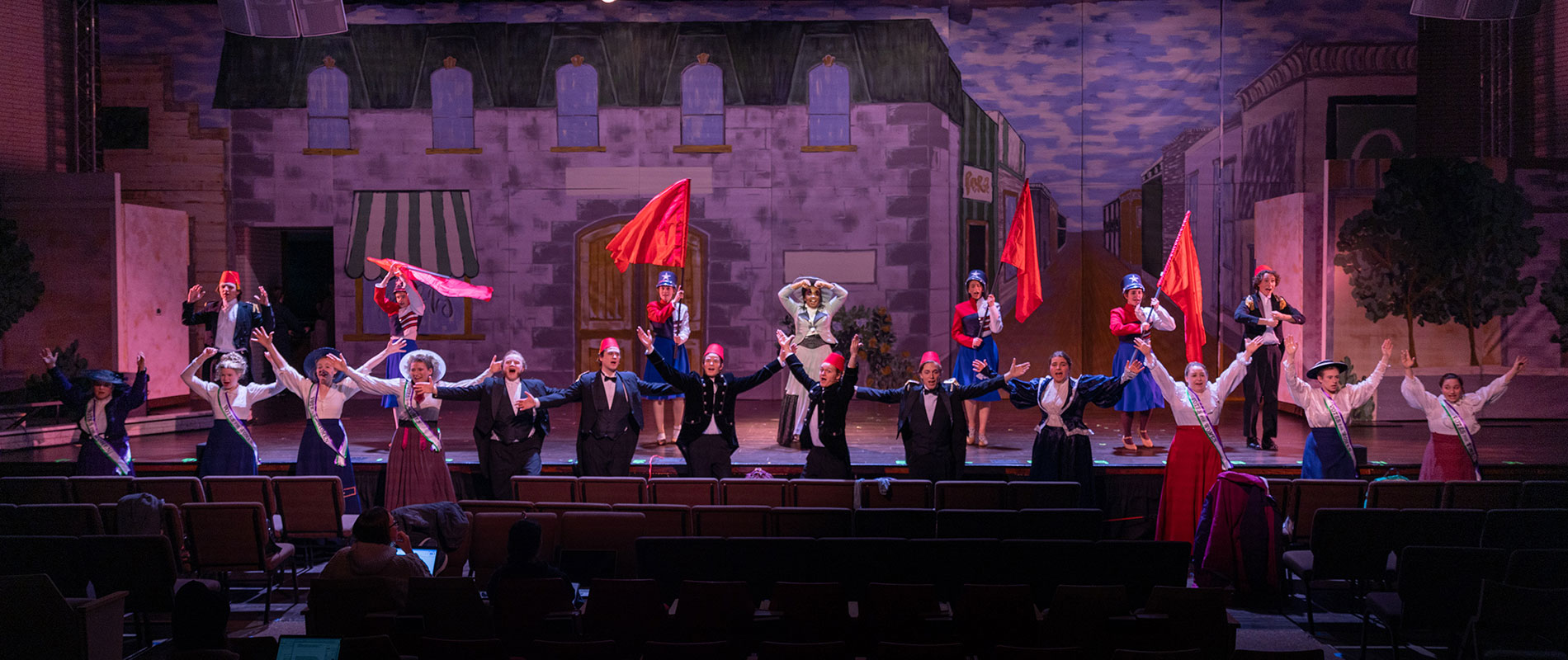 students performing on stage