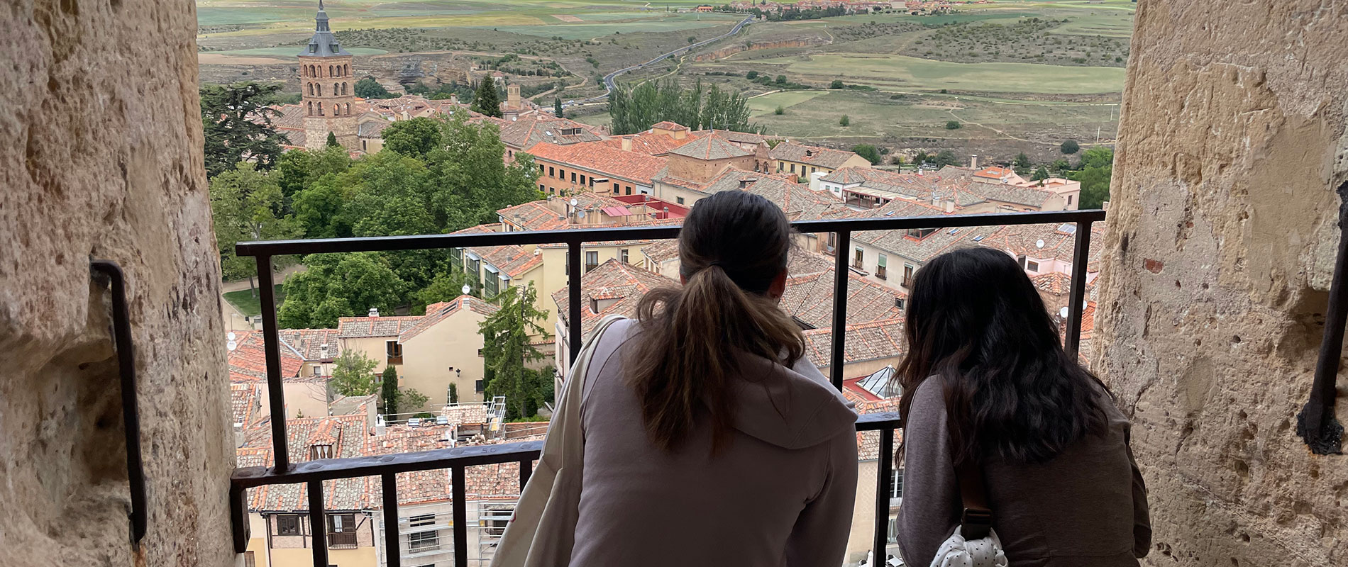students overlooking european village