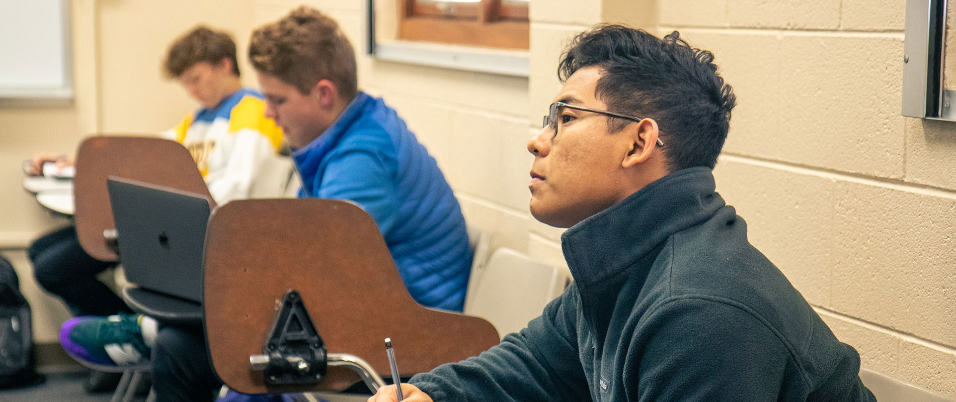 male student in classroom