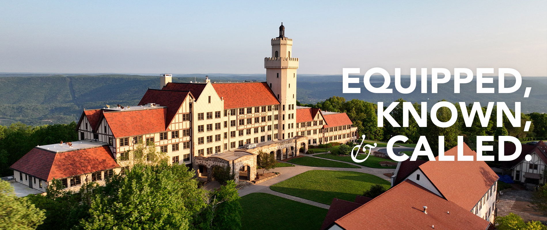 Aerial view of campus with words Equipped known and called overlaid
